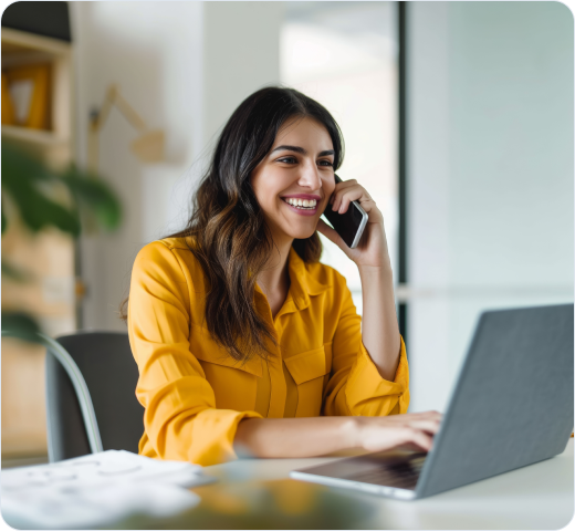 Smiling woman talking on mobile phone